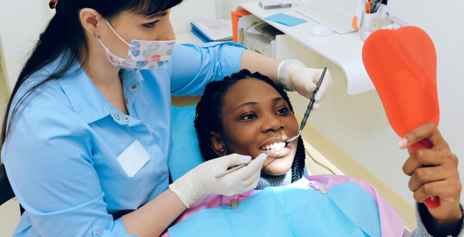 How can we improve access to affordable dental care for low-income individuals?