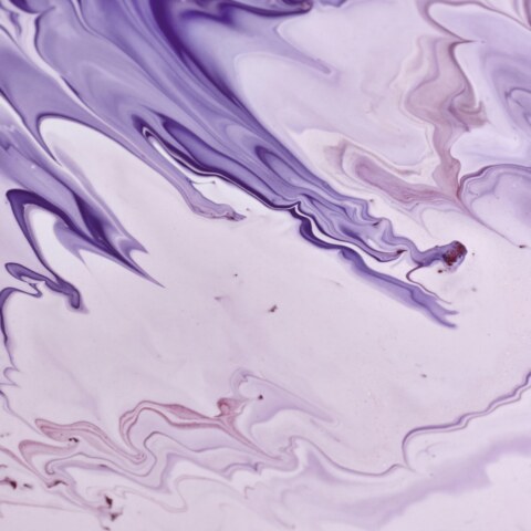 What historical and cultural significance does the rarest purple color hold, particularly in relation to royalty, spirituality, and luxury?