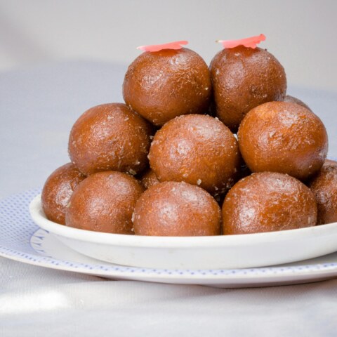 Historical origins and regional variations of Gulab Jamun across India, and how have cultural influences and culinary traditions shaped the evolution of this popular sweet dish over time?