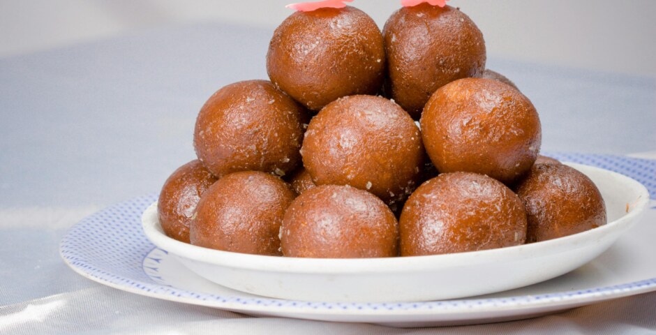 Historical origins and regional variations of Gulab Jamun across India, and how have cultural influences and culinary traditions shaped the evolution of this popular sweet dish over time?