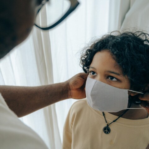 What are the underlying causes of mucus changing color to yellow and green, such as bacterial infections, viral illnesses, environmental pollutants, and allergic reactions, and how do these factors influence the body's immune response and inflammatory processes?