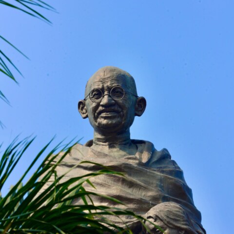 What are the aspects of Mahatma Gandhi's early life and experiences, such as his upbringing, education, and formative influences, and how did these factors shape his worldview and approach to social and political change?