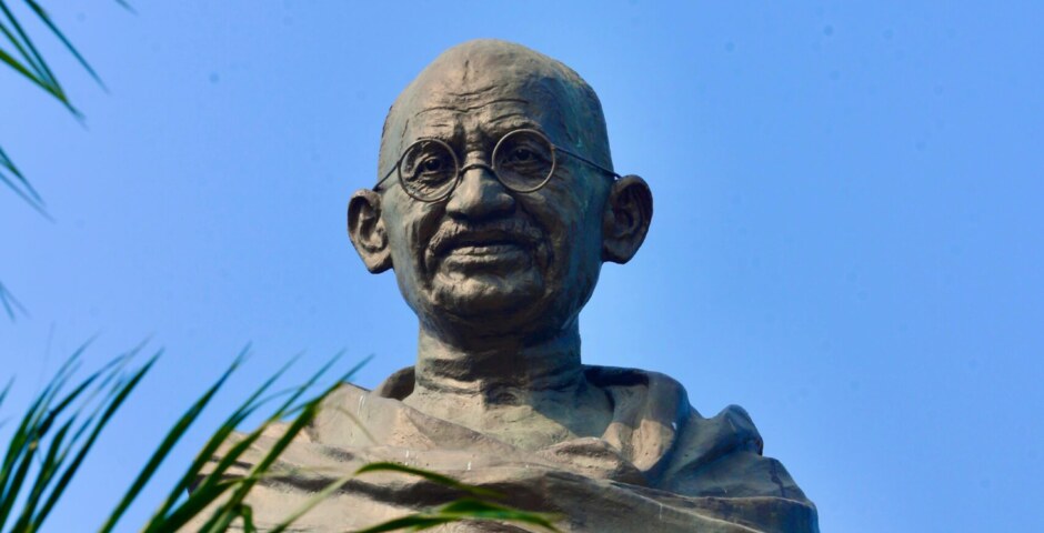 What are the aspects of Mahatma Gandhi's early life and experiences, such as his upbringing, education, and formative influences, and how did these factors shape his worldview and approach to social and political change?