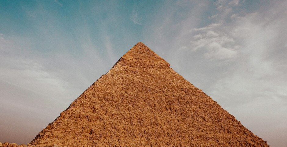 How did the ancient Egyptians align the Great Pyramid of Giza with astronomical phenomena such as solstices, equinoxes, and star positions, and what significance did these celestial alignments hold for religious, agricultural, and calendrical purposes?