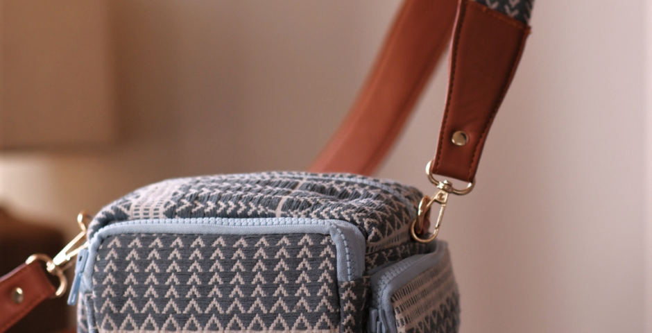 What makes the Rattan Weave Sling Bag in Black from IRO a perfect blend of elegance and functionality for modern explorers?